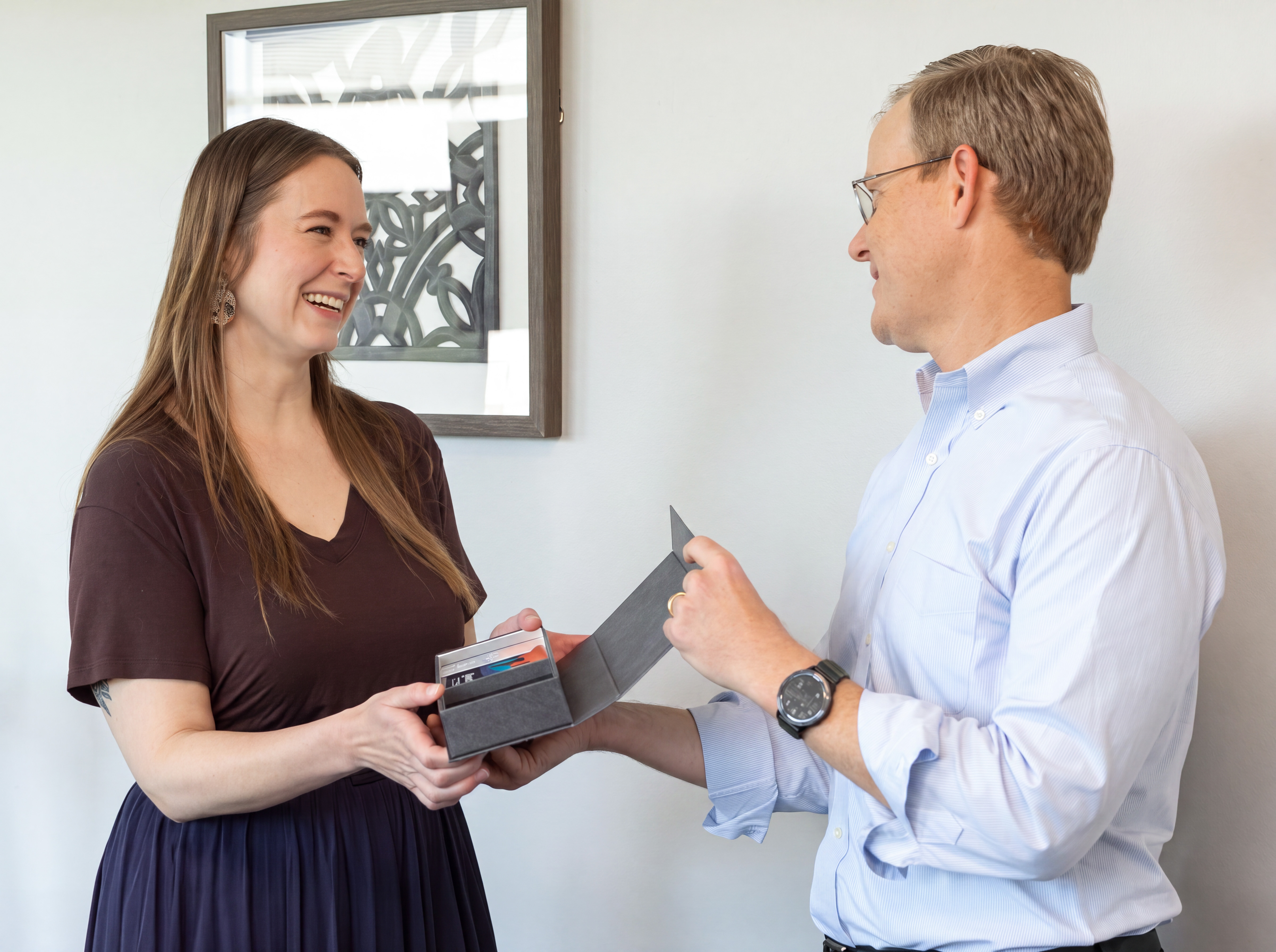 Symbolic award being presented to an employee